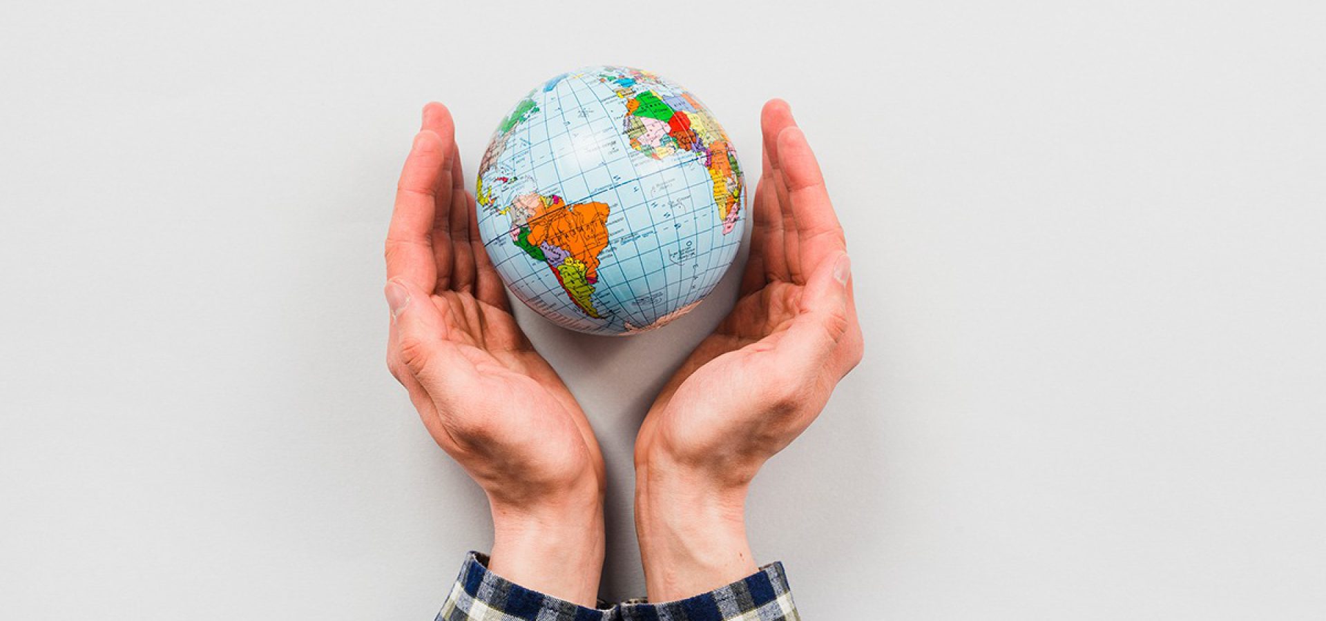 earth-globe-surrounded-by-hands